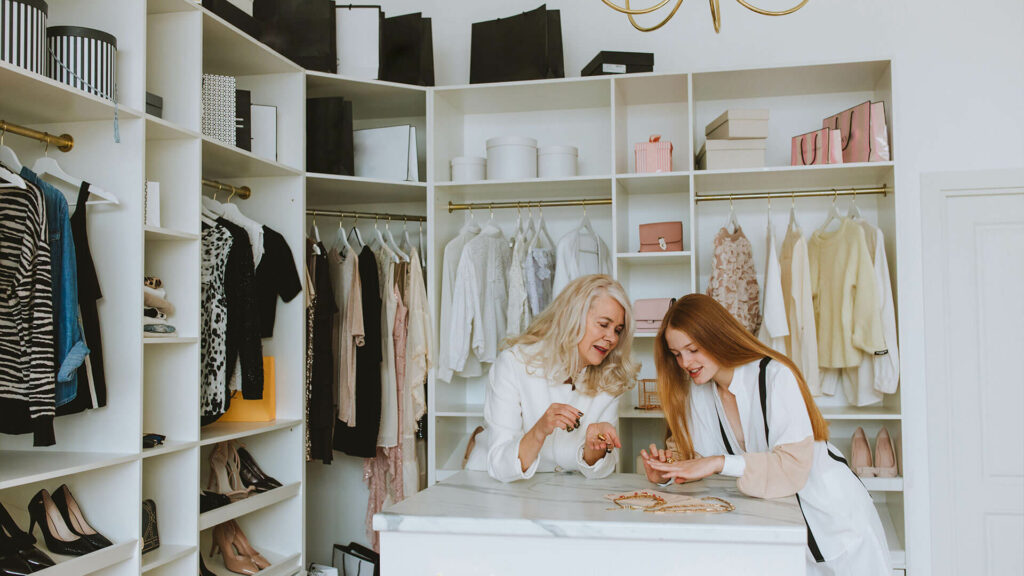 two women trying jewelry